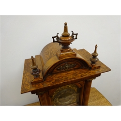  Edwardian oak architectural mantle clock circa 1908, arched top with urn and spire finials, square brass dial with silvered Roman chapter, enclosed by brass caped column door on brass paw feet, Jungans twin train movement striking the quarter hours on two coils, W33cm, H58cm, D21cm  