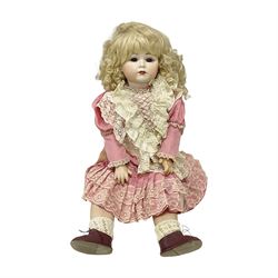 Reproduction Simon & Halbig bisque head doll with applied hair and jointed limbs; marked Simon & Halbig 117, H58cm