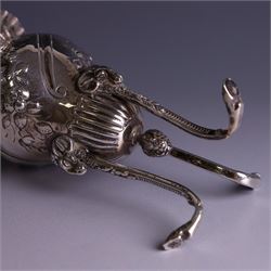 Late Victorian silver vase, of baluster form with fluted rim, the body with embossed floral decoration, upon three tall legs with ramshead mounts, hallmarked William Comyns & Sons, London 1890, H13.5cm