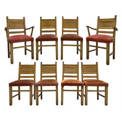 Early to mid-20th century set of eight (6+2) limed oak dining chairs, reed moulded backs carved with arcades, upholstered seats, on square supports united by plain stretchers 