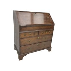 George II oak bureau, fall front revealing fitted interior with sliding writing well, above two short and two long drawers