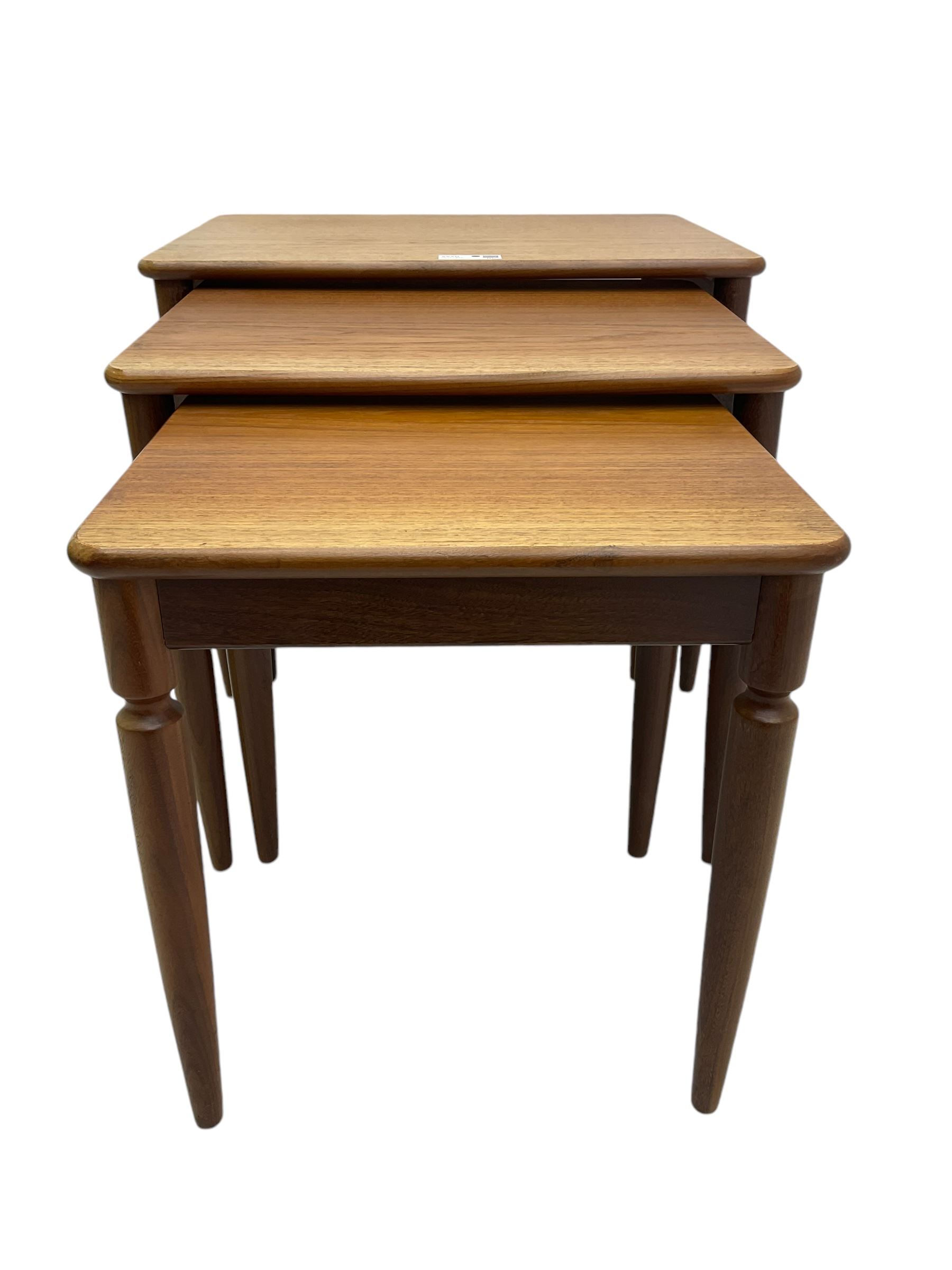 G-Plan - teak nest of three tables, rectangular top raised on turned supports
