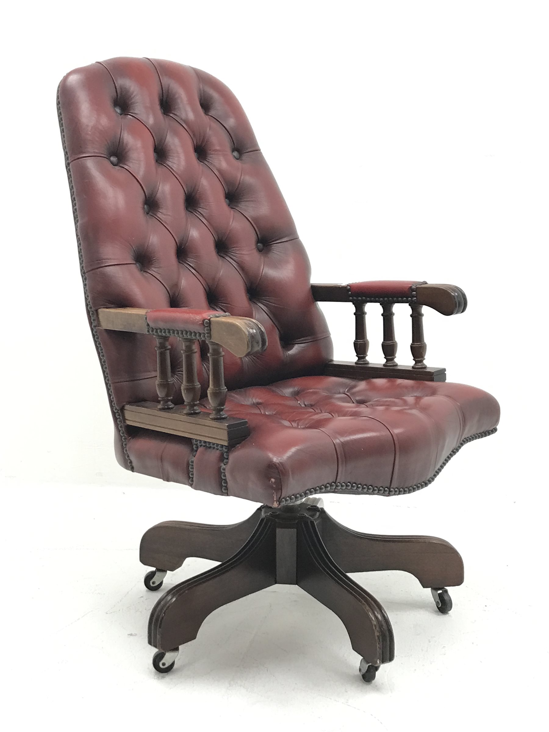 Swivel reclining desk chair upholstered in deep buttoned oxblood leather, W60cm