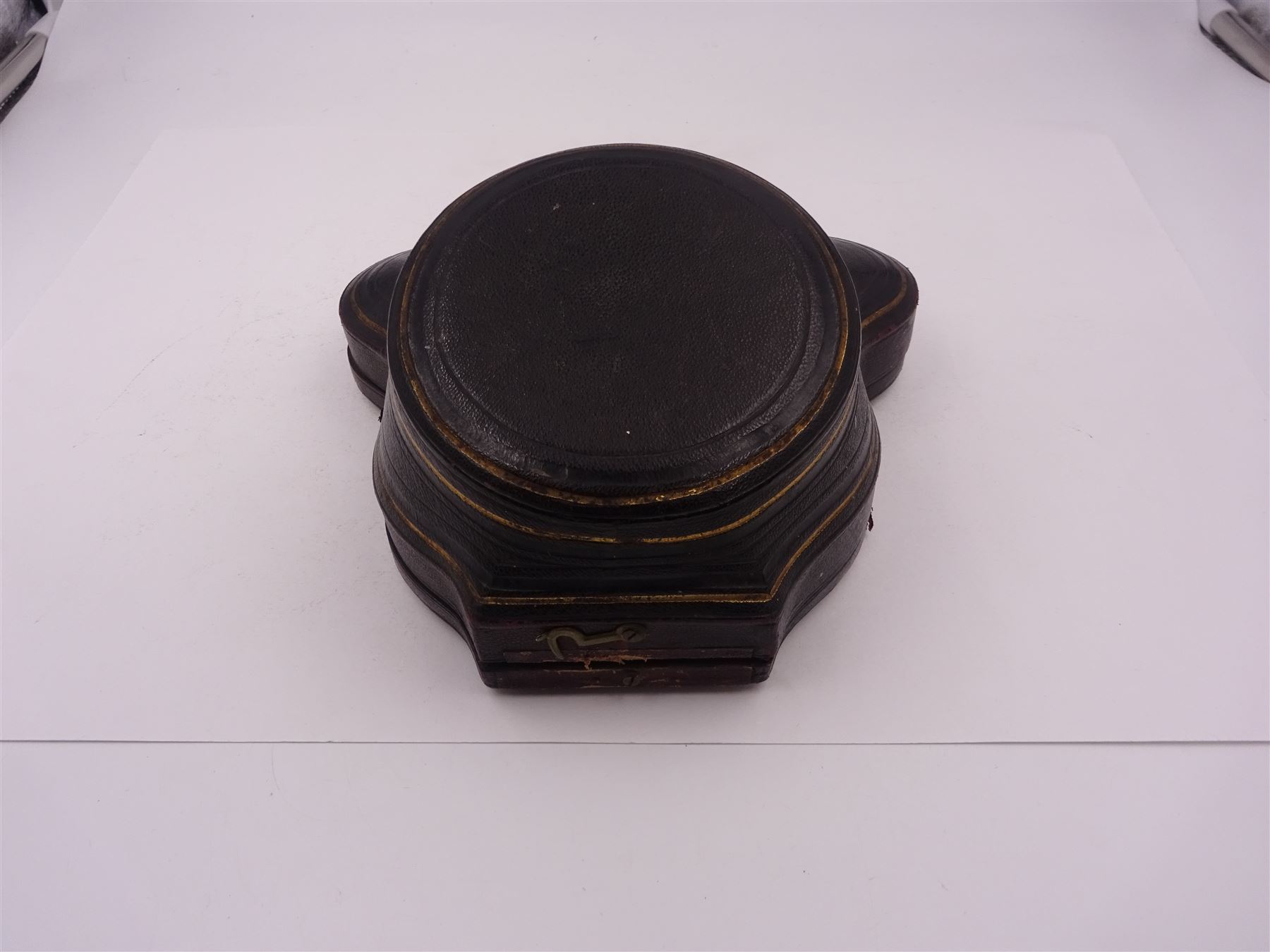 Victorian silver bowl, with embossed floral decoration and beaded rim, gilt interior and two applied shield cartouches, upon stepped circular foot, with a silver apostle spoon, with gilt bowl, both hallmarked George Unite, Birmingham 1883, bowl H5.5cm, within fitted tooled leather, silk lined case