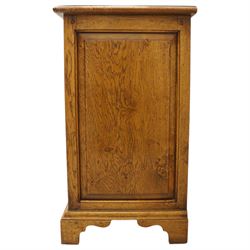 Small 20th century burr oak chest, the figured top over three graduated drawers with moulded fronts and pierced brass handles, on shaped feet