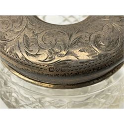 Hallmarked silver top dressing table jars, to include cut glass hobnail example with foliate engraved lid, another 20th century cut glass example with silver engraved screw thread lid, stamped H.S.M Herbert Scott Murdoch, with interior stopper and two smaller glass jars (4)
