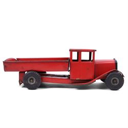 Tri-ang/Line Bros Ltd tin plate tipper truck, red body with black rubber wheels and red seat and steering wheel to interior, H49cm, L16cm