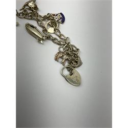 Two Klaus Kobec Entourage gentleman's and ladies, bicolour stainless steel quartz bracelet wristwatches, round white dials with Roman numerals and date apertures, both boxed, silver charm bracelet, silver jewellery and other costume jewellery