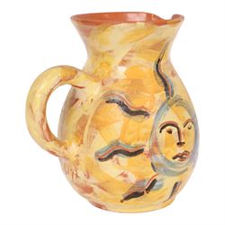 Vallauris French pottery by Patrick Bocca Rossa, jug painted with sun motifs upon a yellow ground, and an octagonal plate with a face to the center, both signed, jug H22cm 