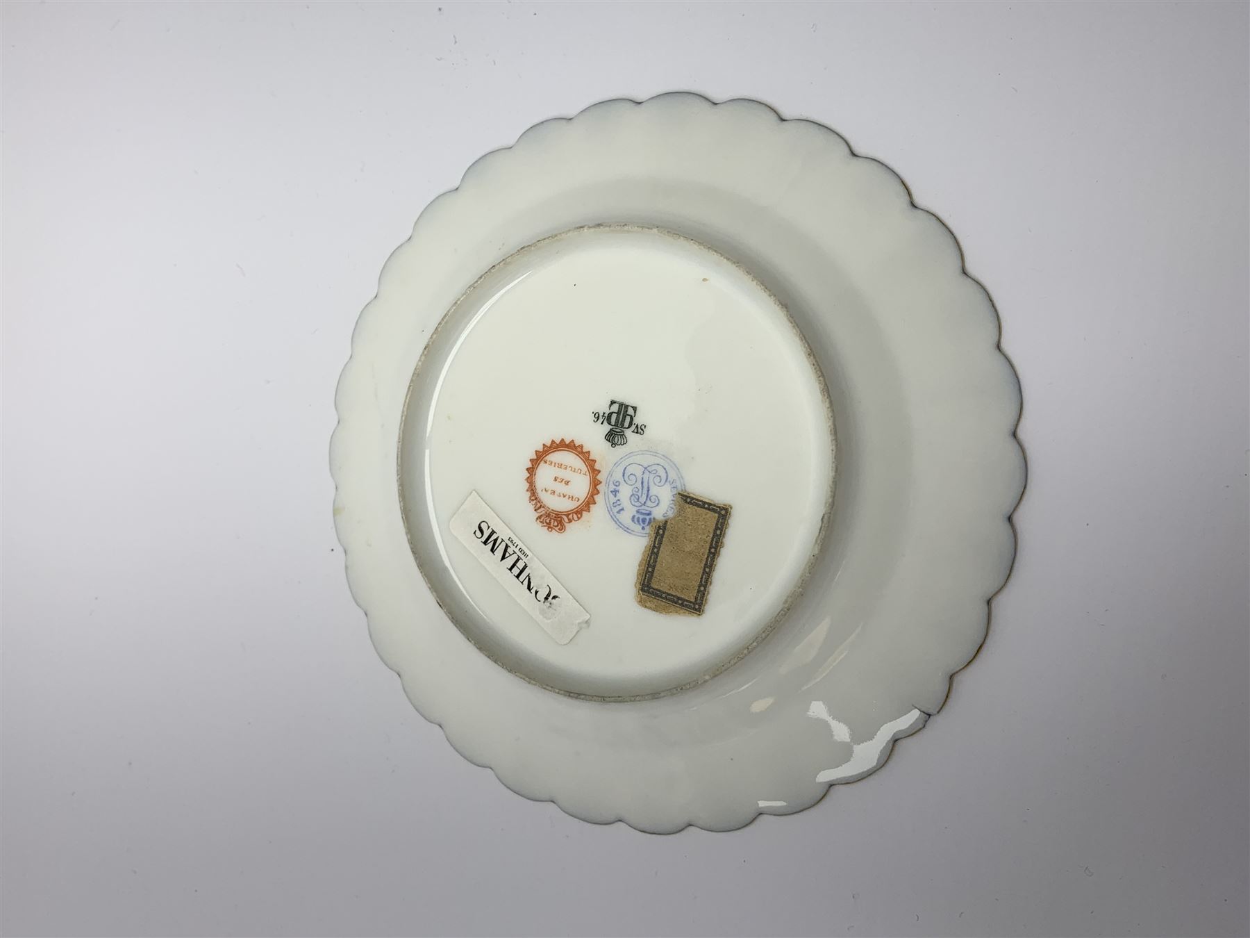 Mid 19th century Sevres Louis Philippe period porcelain cabinet plate, decorated with central Louis Philippe crowned monogram flanked by two cherubs, within cobalt gilt detailed border, with date mark for 1846, red inventory mark for Chateau des Tuileries, and blue monogram mark , D14.5cm