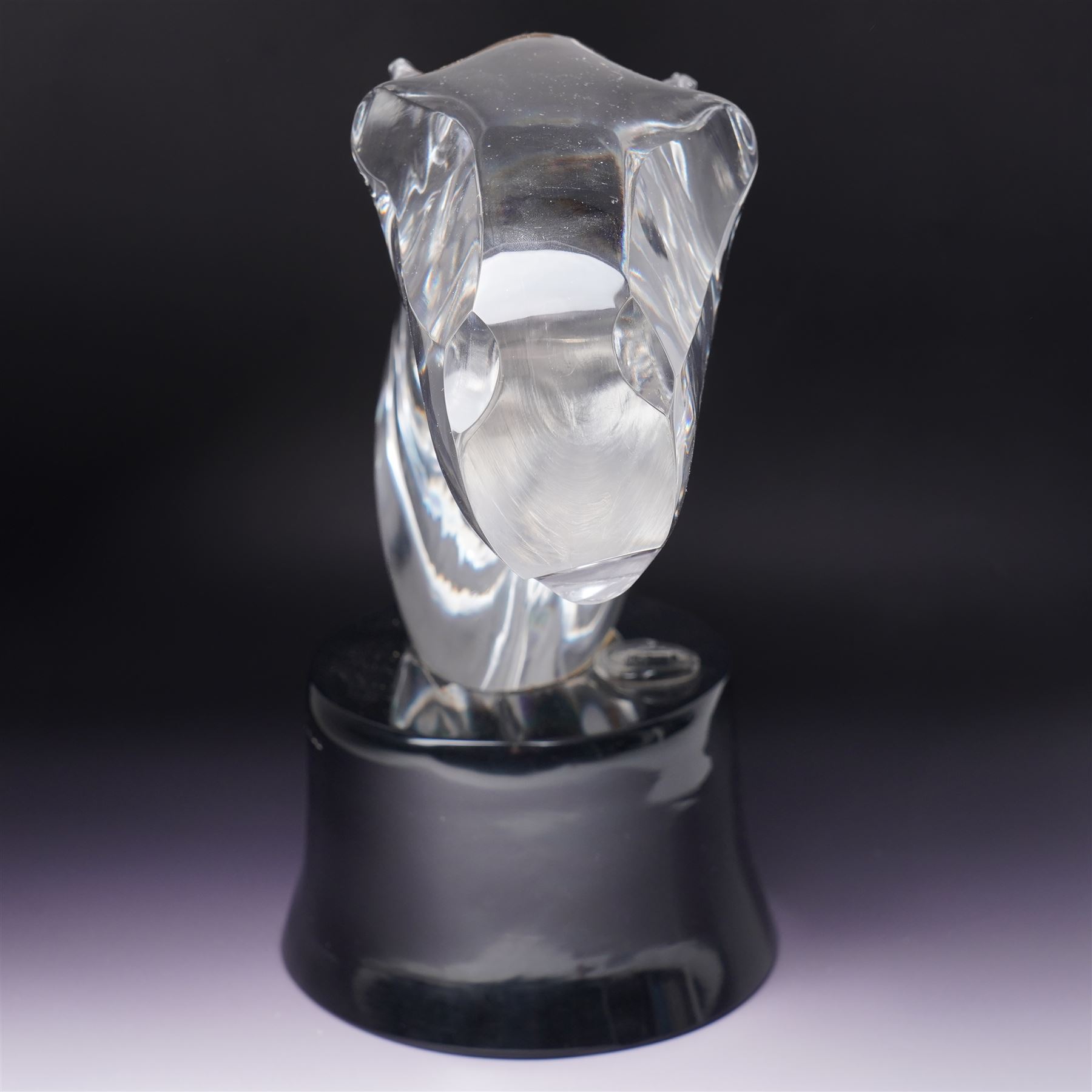 Loredano Rosin (Italian 1936-1992): Horse's Head, clear cut glass sculpture mounted on an oval plinth of black glass with incised signature, with impressed makers medallion, overall H35cm W47cm 
Notes: Rosin was widely exhibited Murano glassmaker who collaborated with artists such as Picasso and Chagall, this piece probably dates from the 1960s. 