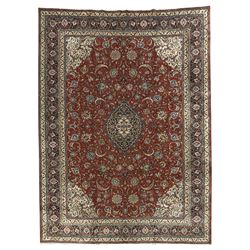 Persian Sarouk dark indigo and crimson ground rug, the medallion, field and spandrels deco...