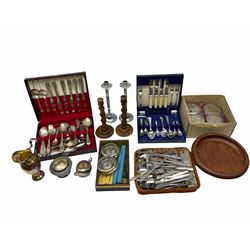 Collection of flatware, two cased canteens, a pair of white metal candled stick, a pair of wooden candlesticks, a footed wooden dish etc