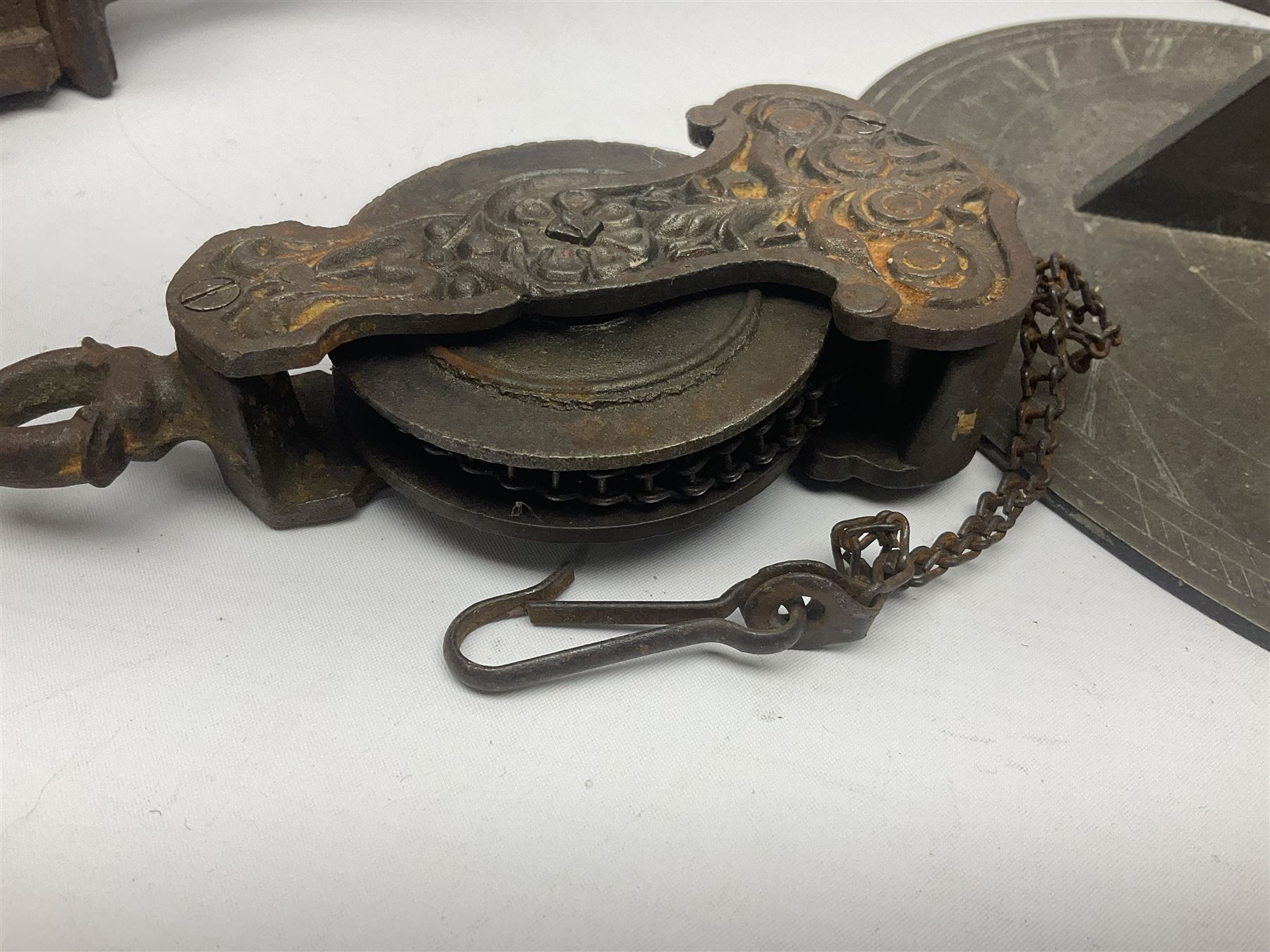 Two 19th century copper tankards, one with weighted wooden base, together with copper and wooden mechanical bellows, sundial and other metalware 