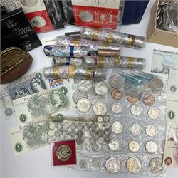 Coins and banknotes including eight United states of America silver dollars, small number of Great British pre 1947 silver threepence pieces,  pre-decimal coins including pennies, Bank of England Hollom five pounds 'H49', Page five pounds '03T' etc