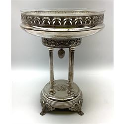 Early to mid 20th Century silver plated table centrepiece of circular form, with clear glass liner supported by bowl with pierced foliate design border raised upon four columns, with circular base supported by four scrolling feet with rams head masks, stamped with bird mark, possibly Phoenix Manufacturing Co. of Melbourne, H33cm