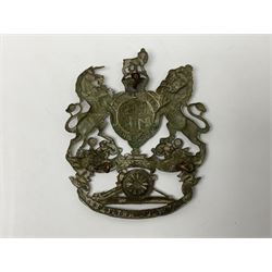 Artillery helmet plate, king's crown crest, the bottom ribbon marked 'Volunteer Artillery' with three fixing eyes verso H9.5cm