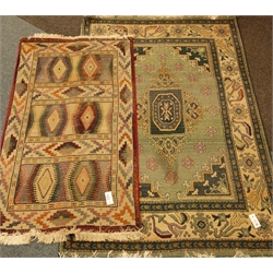  Persian design green ground rug (175cm x 118cm), and another contemporary rug  