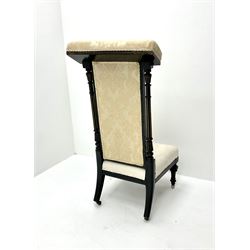 Victorian ebonised prie dieu chair upholstered in an ivory ground fabric, turned reeded and tapering supports