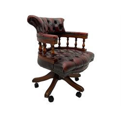 Late 20th century swivel desk chair, upholstered in ox-blood studded leather