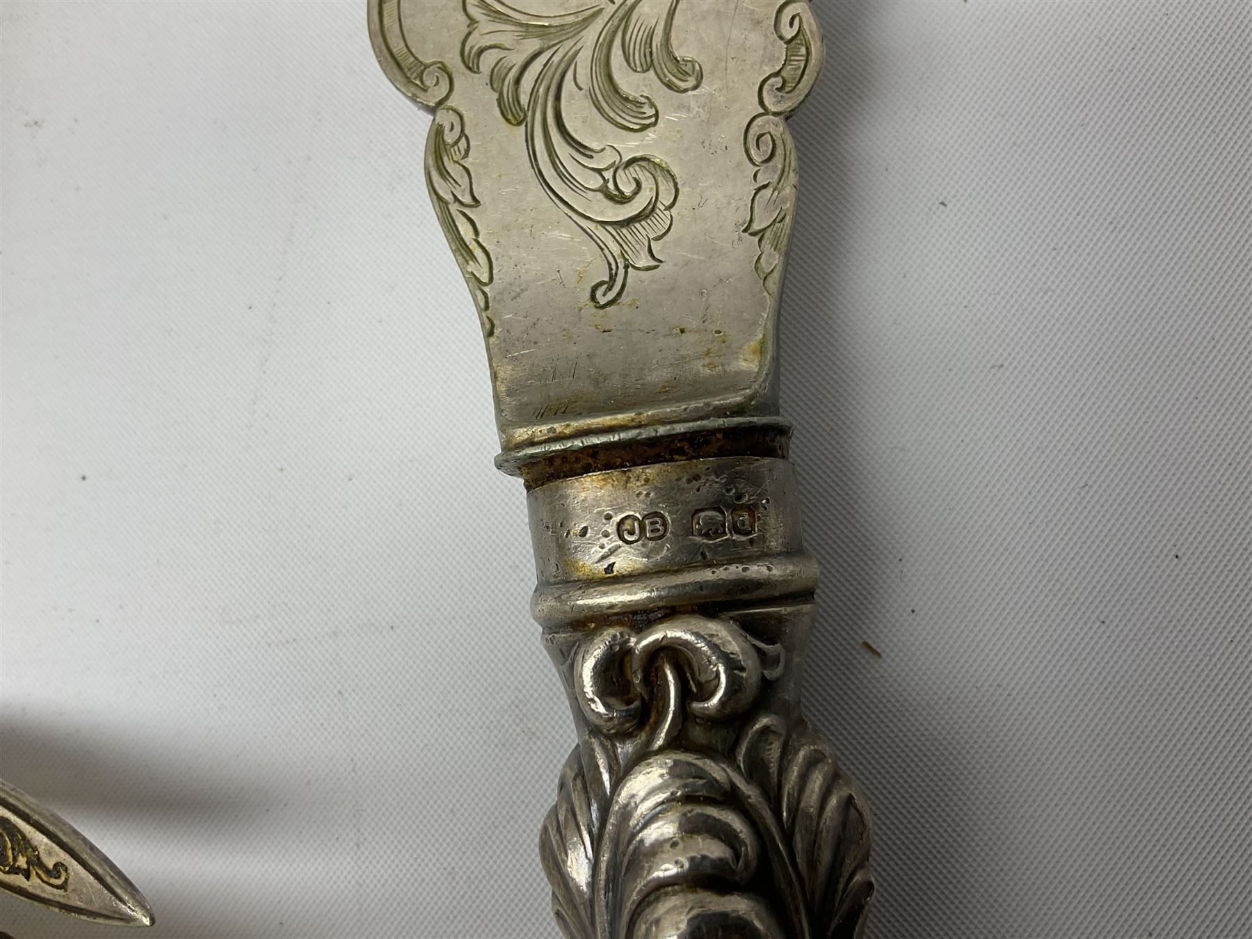 Set of six silver handled butter knives, in case, pair of silver handled fish servers, two silver handled shoe horns, and two silver handled button hooks, all hallmarked or stamped Sterling