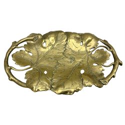 Late 19th/early 20th century twin handled brass centrepiece dish in the form of oak leaves, raised upon four legs, L37cm