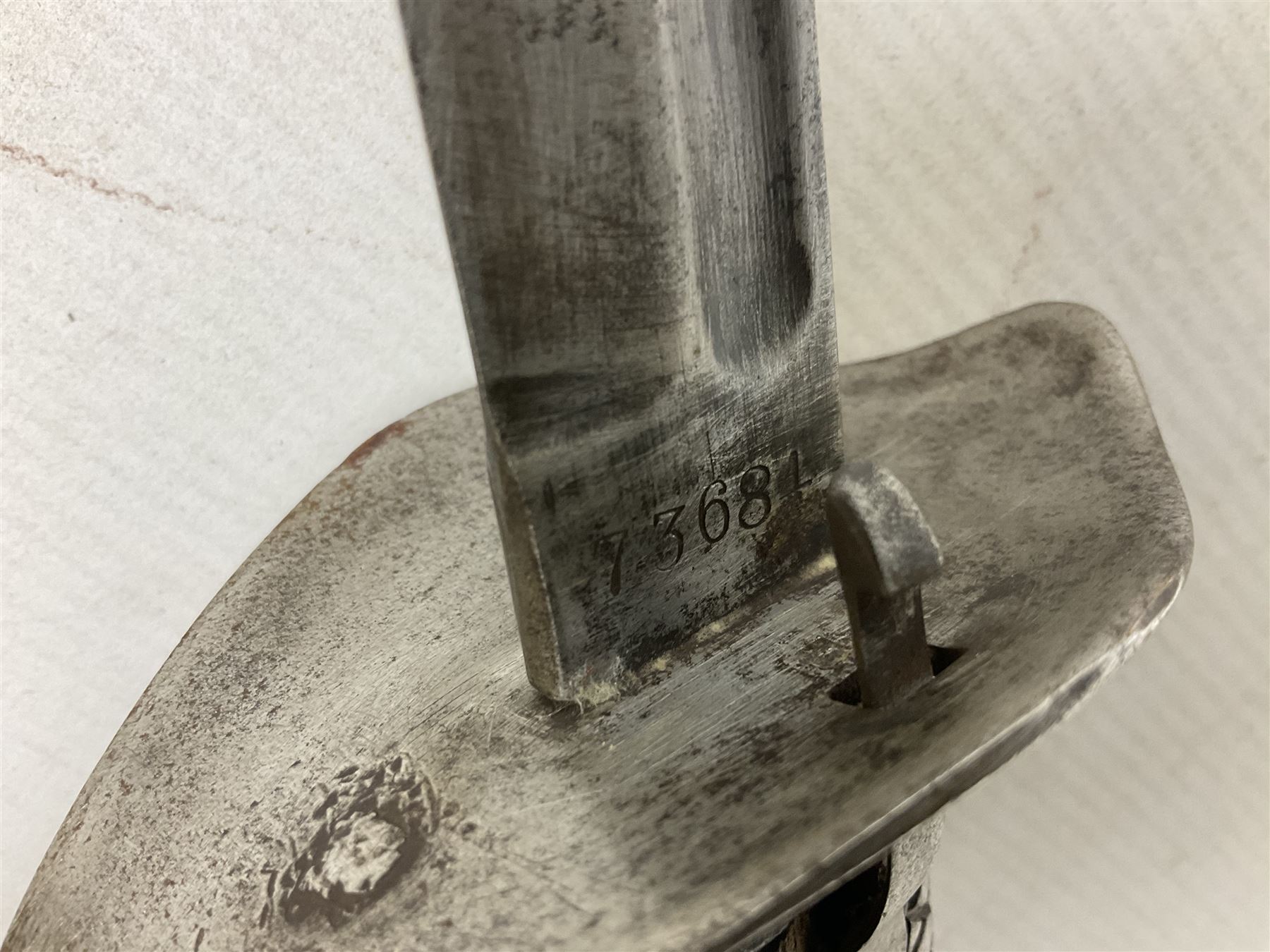 Japanese Model 1899 Type 32 'Otsu' pattern army sword, with 76.5cm single edged, slightly curved blade with narrow fuller, numbered 73684 to the ricasso;  steel hilt with chequered backstrap and grip ears with wooden chequered grip and locking action;  in steel scabbard with single hanging ring L93cm overall