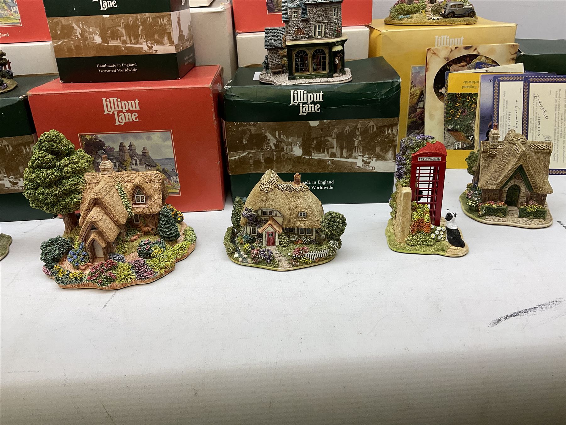 Fourteen Lilliput Lane cottages to include 'Diamond Cottage', 'Kendal Tea House', Visitor's Centre Special 'It's For You' signed to base, The British Collection 'The Sherlock Holmes' etc, all boxed with deeds
