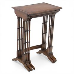 20th century mahogany quartetto nest of tables, the rectangular tops with oval inlay, upon turned knopped supports, united by a curved stretcher, raised upon outswept feet