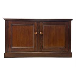 Victorian mahogany cupboard, plain rectangular top above two fielded panel doors opening to shelved interior, raised on a moulded plinth base, with later replacement knob handles