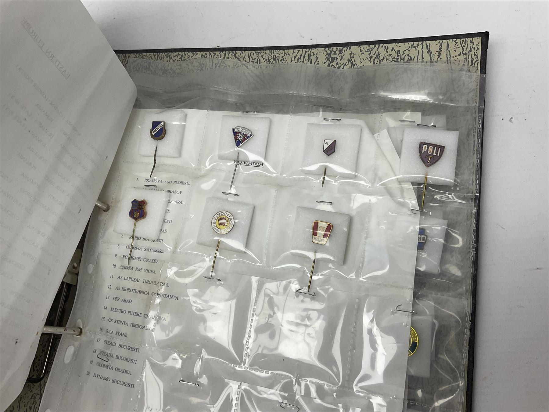 Large collection of approximately one hundred and eighty enamel badges and pins, relating to British and World football clubs, including loose examples and examples housed in folders, mostly identified