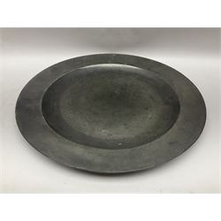 Group of seven 19th century pewter chargers, each of circular form with dished centre, two examples with touch marks verso, each approximately D39cm