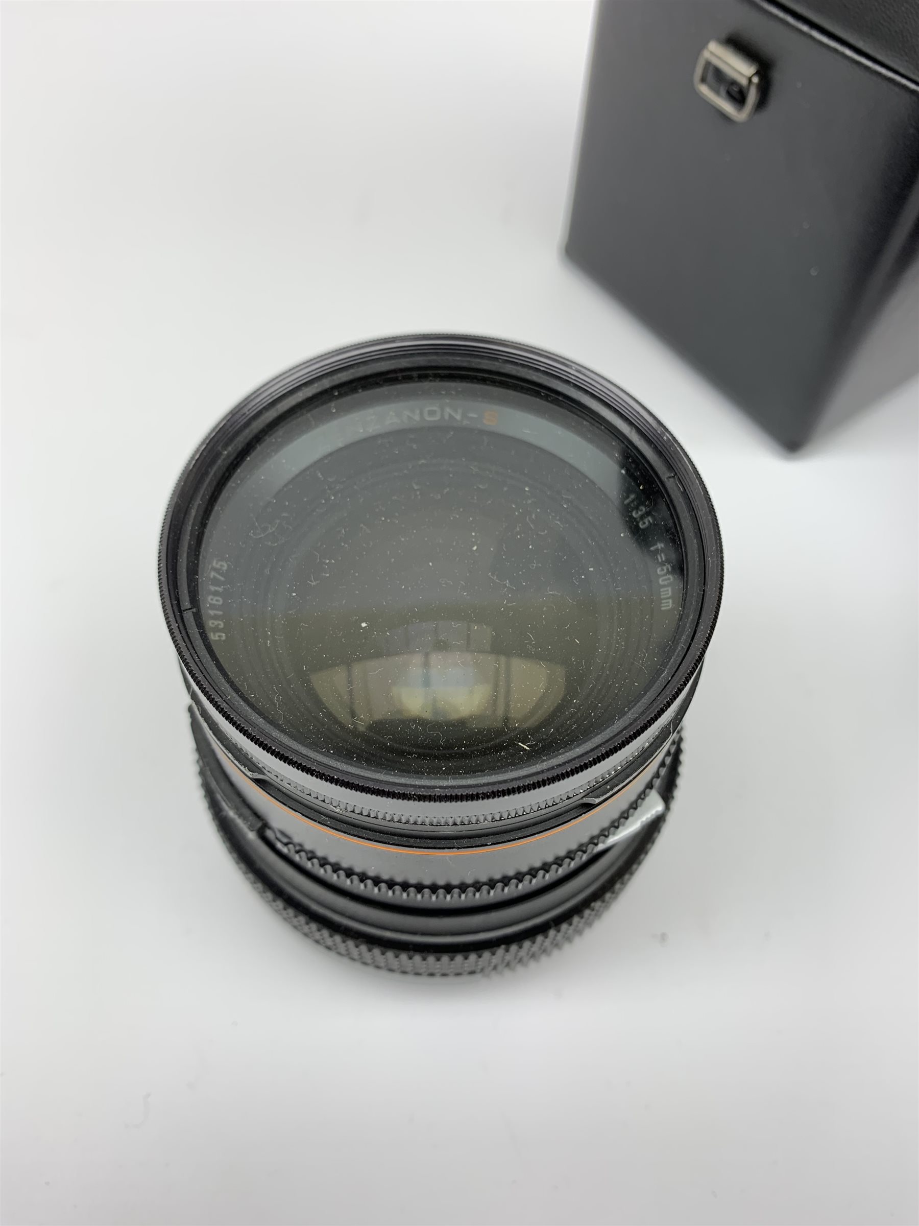 'Zenza Bronica SQ-B' camera fitted with 'Zenza Bronica Zenzanon-PS 1:28 f=80mm' lens, 'Zenza Bronica Zenzanon-PS 1:4 f=150mm' lens and 'Zenza Bronica Zenzanon-S 1:35 f=50mm' lens, with an instruction booklet