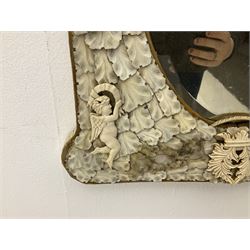 Pair 19th century French Dieppe bone and ivory wall mirrors, the oval bevelled mirror plates within rectangular frames with shaped tops, profusely decorated with ivory leaves, further detailed with carved bone armorial type crest inscribed 'SGOTORVM', putti, fish and mask heads, H81cm W48cm