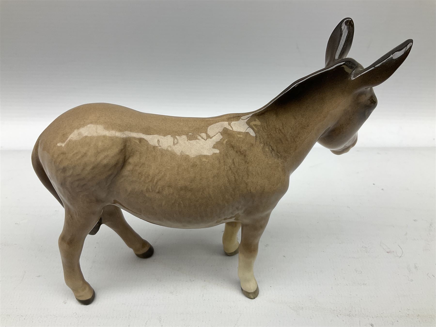 Beswick donkey family to include no.1364b, no.2267a, another donkey and donkey foal (4)