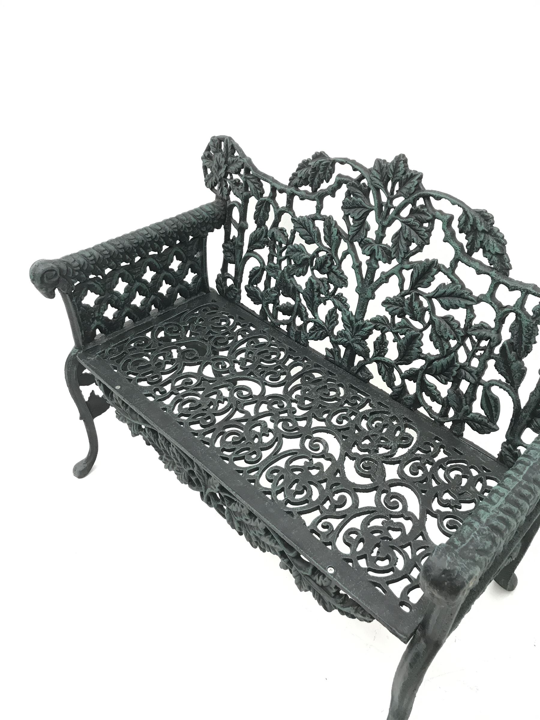 Pair Victorian style cast iron garden benches, ornate interlacing foliage and shaped back, scroll work seat, the leaf moulded arms with rams head terminals, shaped and splayed supports

Location: Duggleby Storage, Scarborough Business Park YO11 3TX