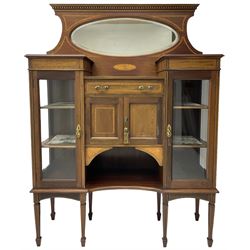 Edwardian inlaid mahogany break-front mirror back side cabinet, dentil cornice over bevelled oval mirror plate, fitted with single drawer and double cupboard over under-tier flanked by two glazed cabinets, decorated with all-over satinwood banding, on square tapering supports with spade feet
