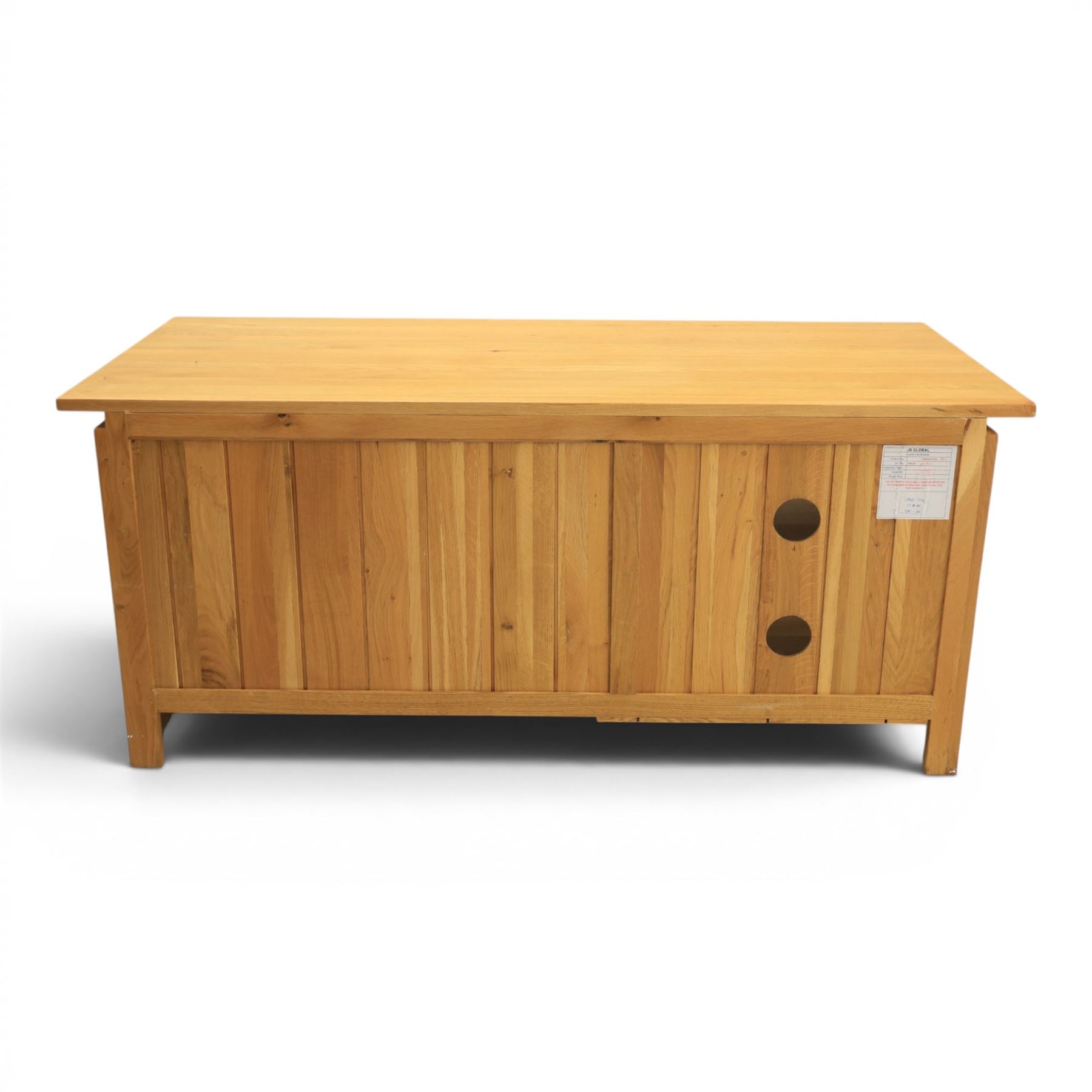 Contemporary light oak television or media unit, two drawers and two open shelves, with apertures for wires