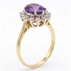 18ct gold amethyst and diamond cluster ring, single oval cut amethyst surrounded by sixteen single cut diamonds, London 1967