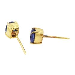 Pair of 18ct gold sapphire earrings, each stud set with a single oval cut sapphire, total sapphire weight approx 0.60 carat