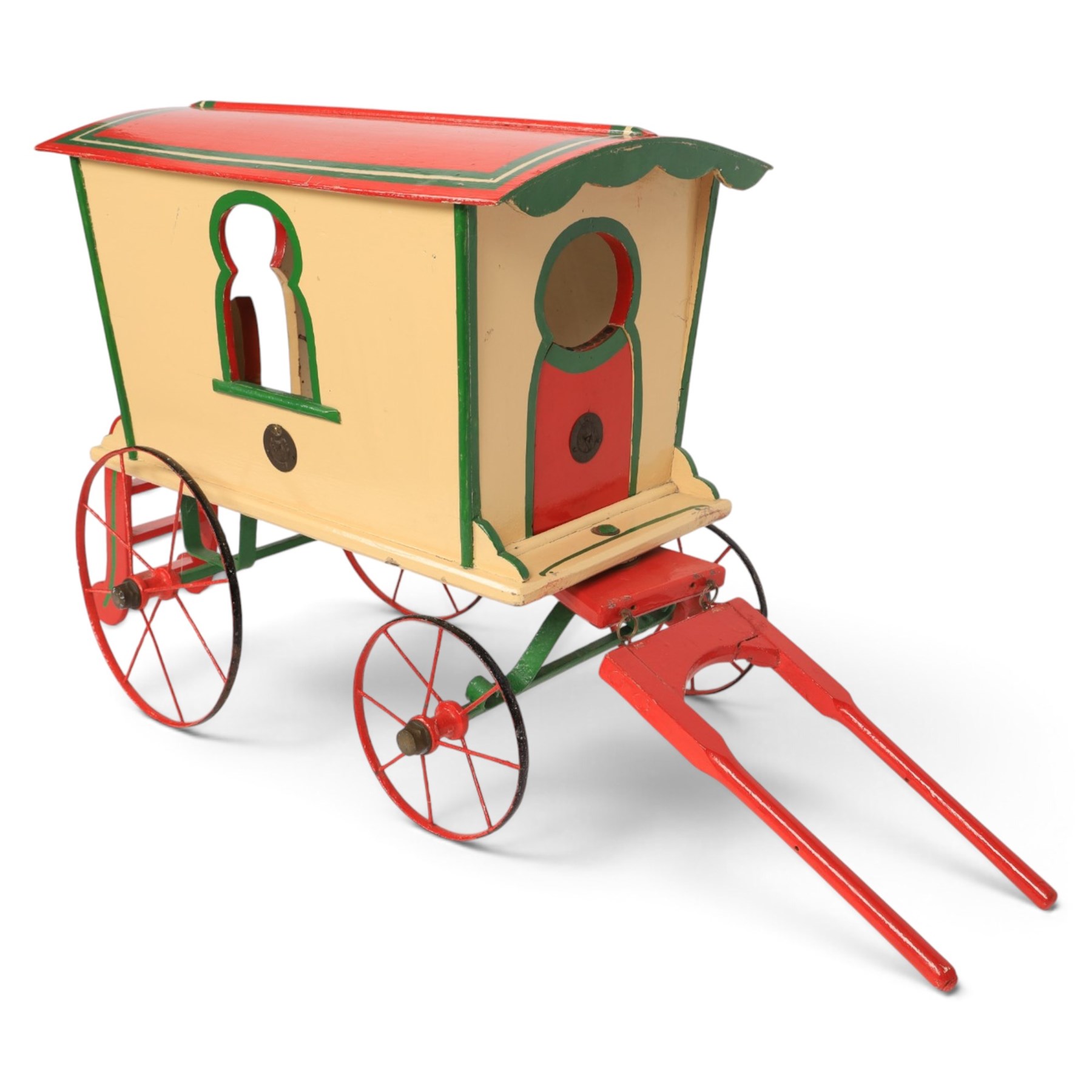 G & J Lines wooden gypsy caravan model, painted in cream with red roof, wheels and green detailing, H51cm, L89cm