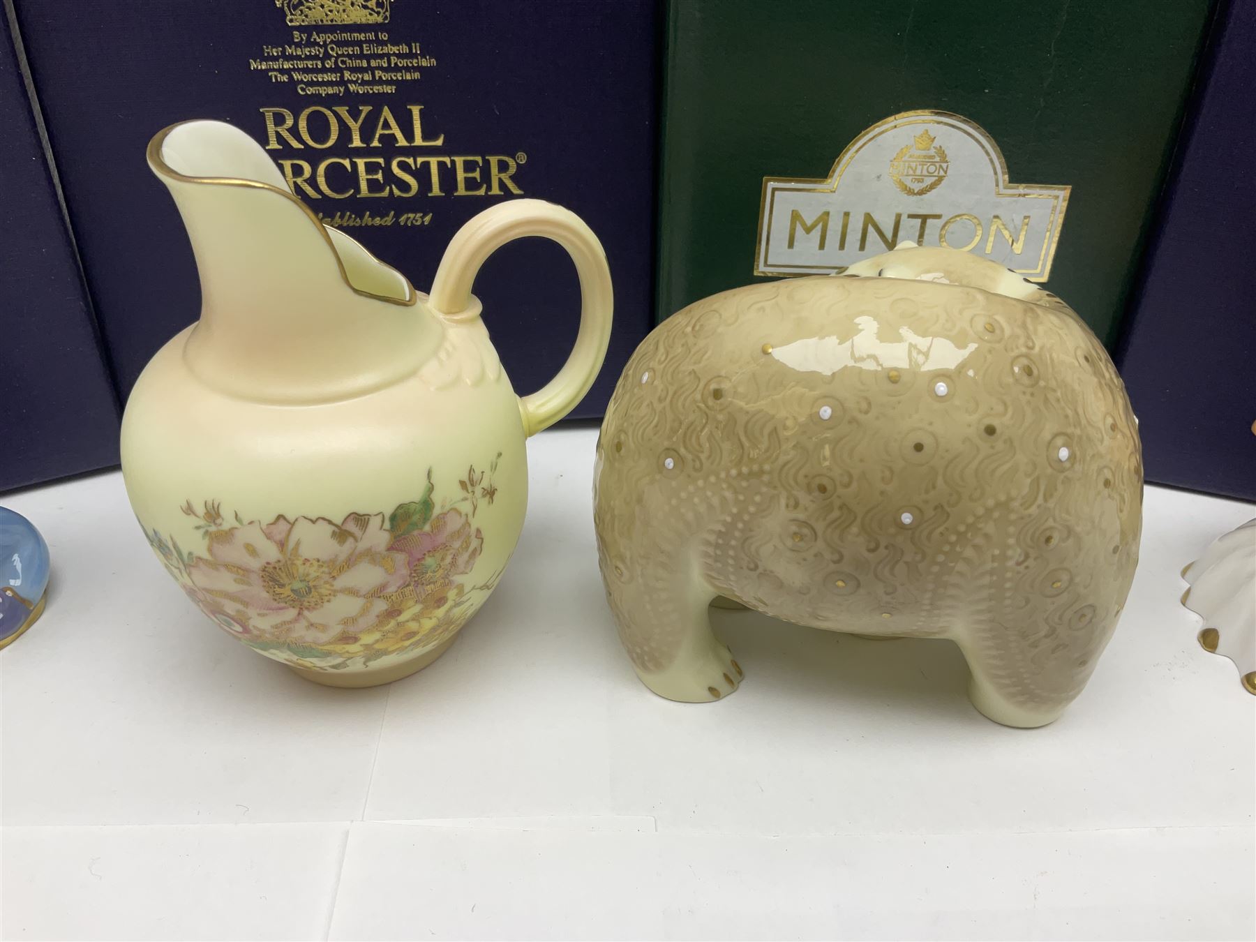 Two Royal Worcester candle snuffers from the connoisseur collection, comprising of Baby and Toby, together with Minton Fawn on Ivory Polar Bear and one other, all with original boxes 