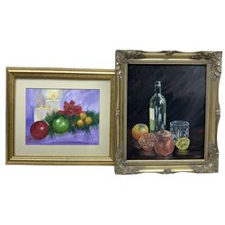 Nina Pickup (British 1947-): Still Life of Wine and Fruit and Still Life of Candles and Wreath, oil on board and watercolour, respectively, signed max 29cm x 24cm (2)