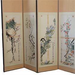 Large 20th century eight panel folding screen decorated with Chinese watercolours of blossoming trees, the watercolours backed onto foliate patterned silk panels, each inscribed and signed with artists seal, with navy fabric to the opposing side, each panel measuring 47cm x 163cm