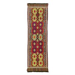 Flatweave geometric design rug, decorated with trailing hooked medallions within zig-zag bands, bright multi-coloured ground 