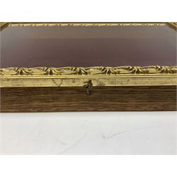 Table top display cabinet, the glazed hinged lid with ornate gilt border, together with two boxes with inlaid geometric decoration, and two other wood boxes, largest W55.5cm D36cm H7.5cm