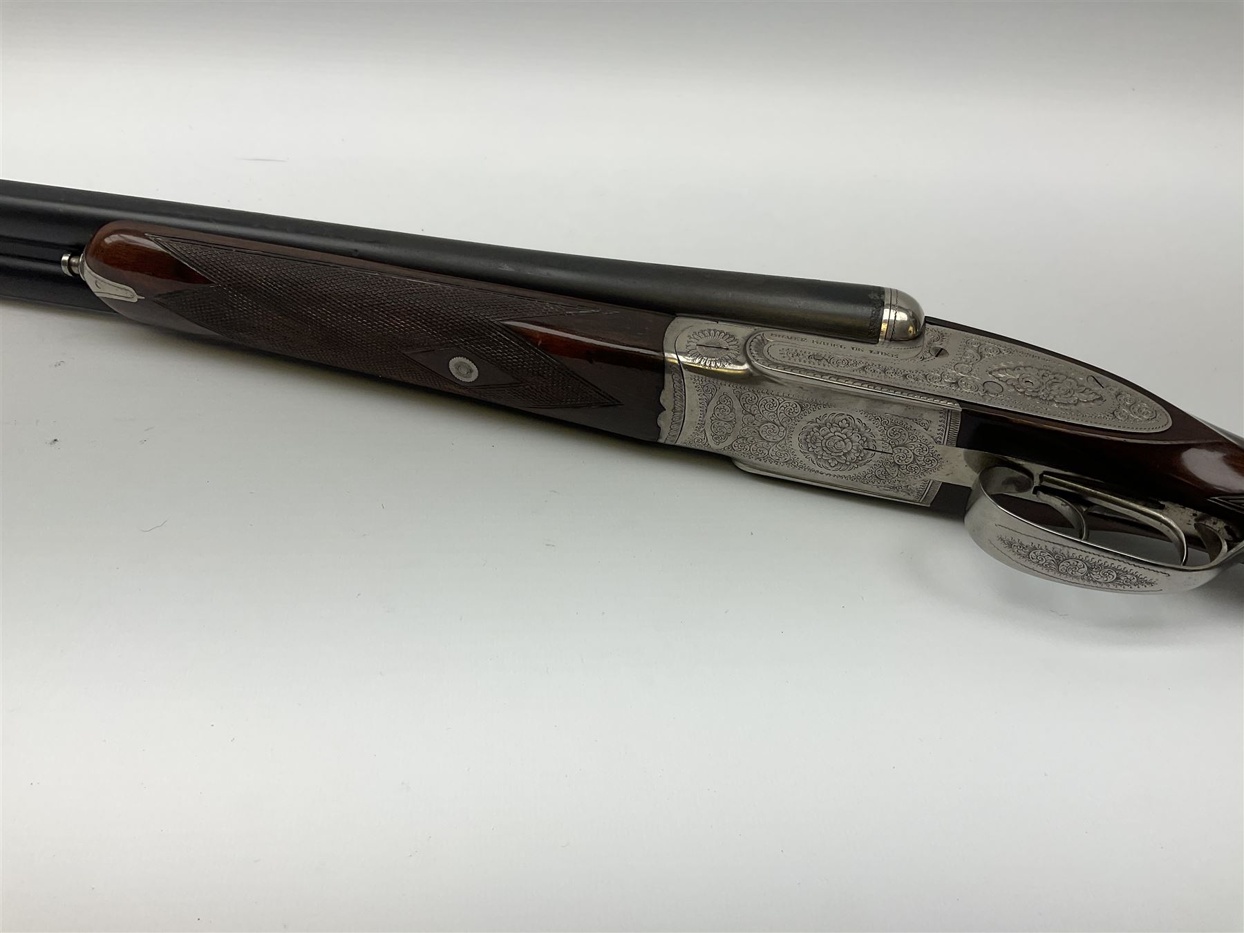 Gunmark Silver Sabel De Luxe 12-bore side by side double barrel side lock ejector sporting gun, 68.5cm barrels with 2.75cm chambers and matt bluing, walnut stock with chequered grip and fore-end and thumb safety, serial nos.12509 & 100.085, L111.5cm overall SHOTGUN CERTIFICATE REQUIRED
