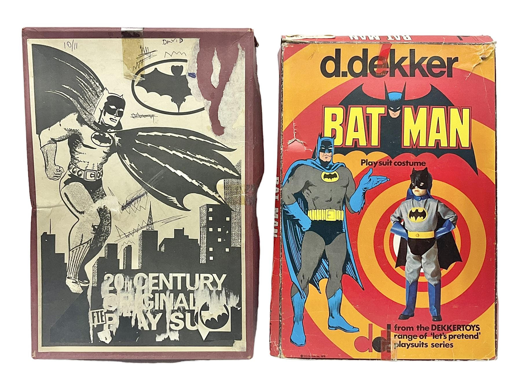 Two Boxed Batman Playsuit Costumes - 1960s 20th Century Original Play Suit, black eye mask, plastic vinyl cape/gauntlets, leather style belt, blue/yellow shirt, with Bat motif and blue/yellow pants; in original illustrated lidded box; and 1976 Decker Batman Playsuit costume, vinyl cape/ mask/gloves/boot tops/yellow belt, grey cloth top and pants; in original illustrated box (2)