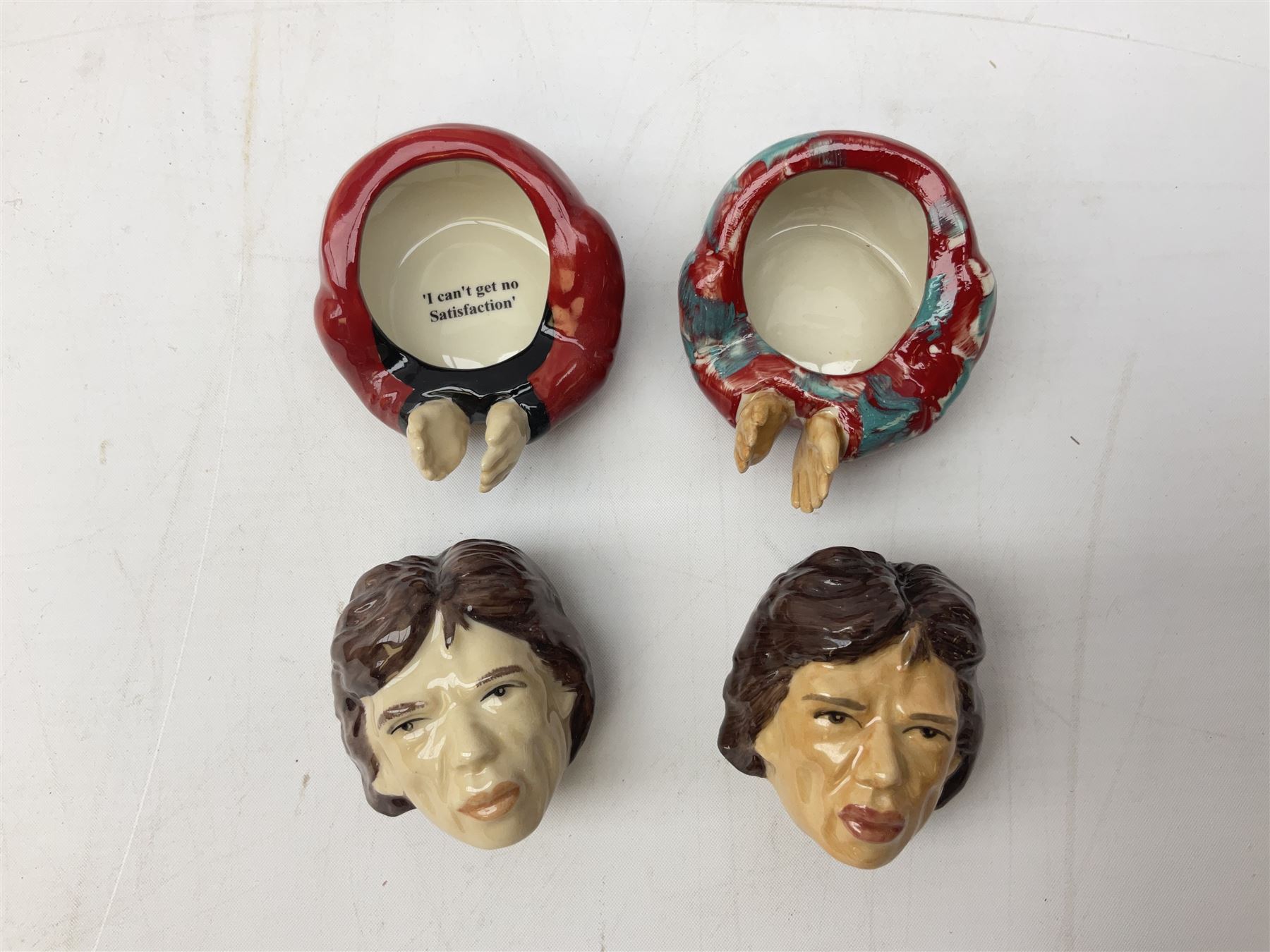 Fifteen Face Pots by Kevin Frances, all of music interest, to include the Beatles; Paul 'Kookoocachu', 'Love Is All You Need', 'Octopus's garden', 'While My Guitar Gently Weeps', 'All You Need Is Love' and 'Everybody's talking and no one says a word', Elton John; I'm still standing, Buddy Holly; 'That will be the day', David Bowie 'We can be heroes' , Mick Jagger prototype colour type etc, all boxed  