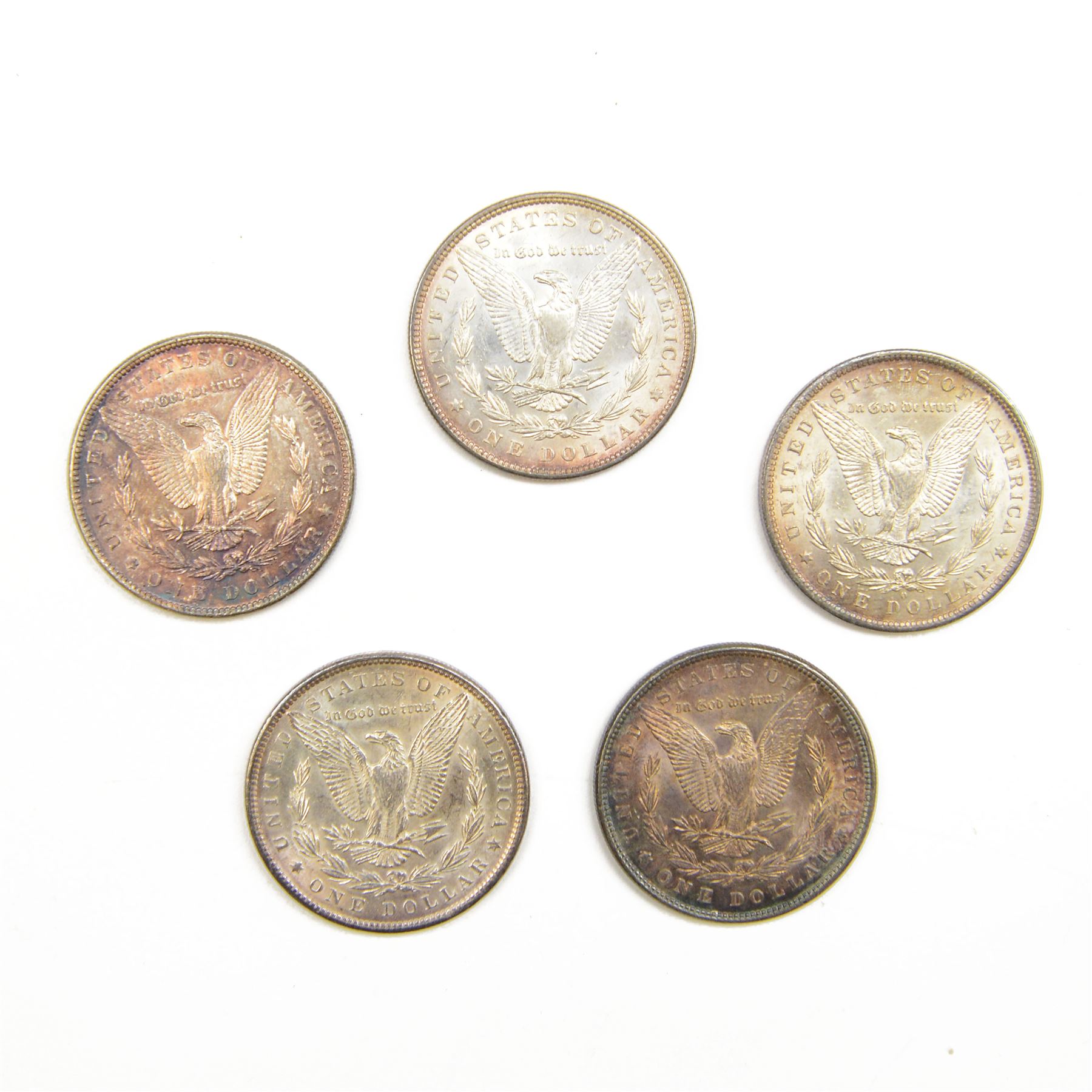 Five United States of America silver Morgan dollar coins, dated 1882, 1883, 1884 O, 1885 and 1889